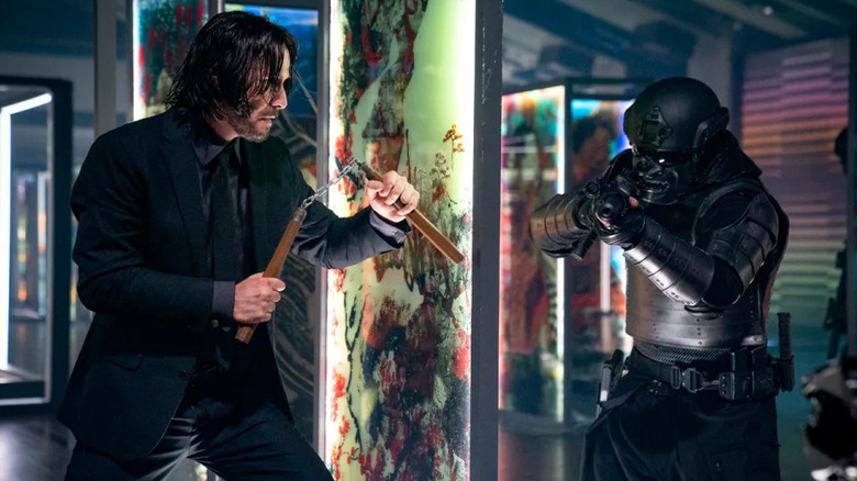 Keanu Reeves as John Wick fighting