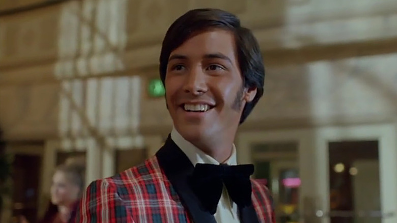 Julian in a dandyish suit in Even Cowgirls Get the Blues
