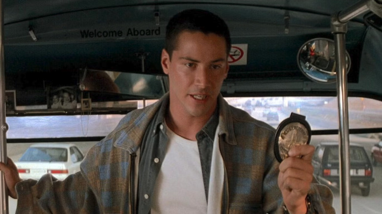 Speed, Jack showing his badge on the bus