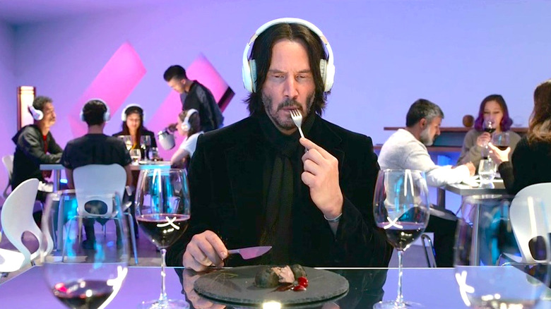 Keanu Reeves eats venison while wearing headphones in Always Be My Maybe