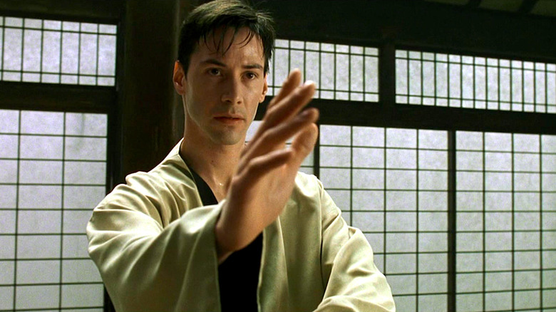 Keanu Reeves prepares to fight in The Matrix