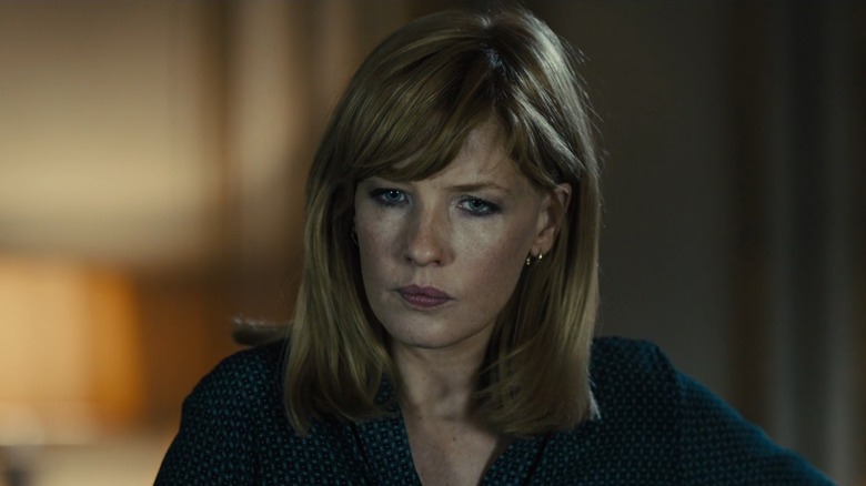 Kelly Reilly as Karen Dacre with a stern look on her face in Bastille Day