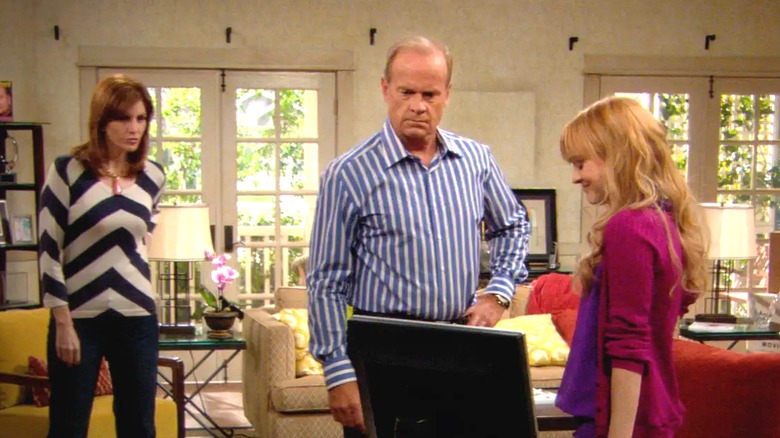 Kelsey Grammer's Hank Pryor looks at a computer screen as Melinda McGraw's Tilly Pryor and Jordan Hinson's Maddie Pryor watch in Hank