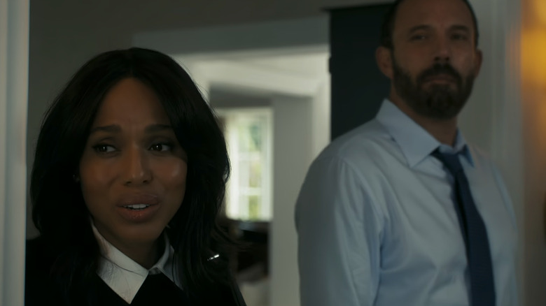 Kerry Washington's Abigail Kimball stands beside Ben Affleck's Mark Kimball as they look off to their right in Animals