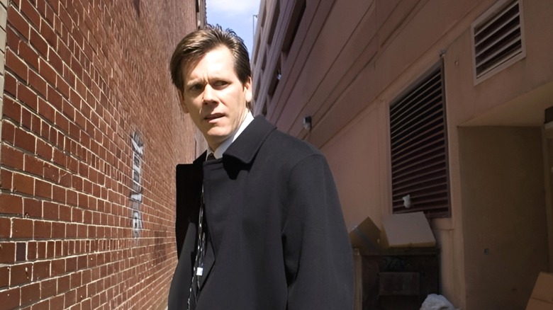 Kevin Bacon's Nick Hume stares at someone in the alleyway in Death Sentence