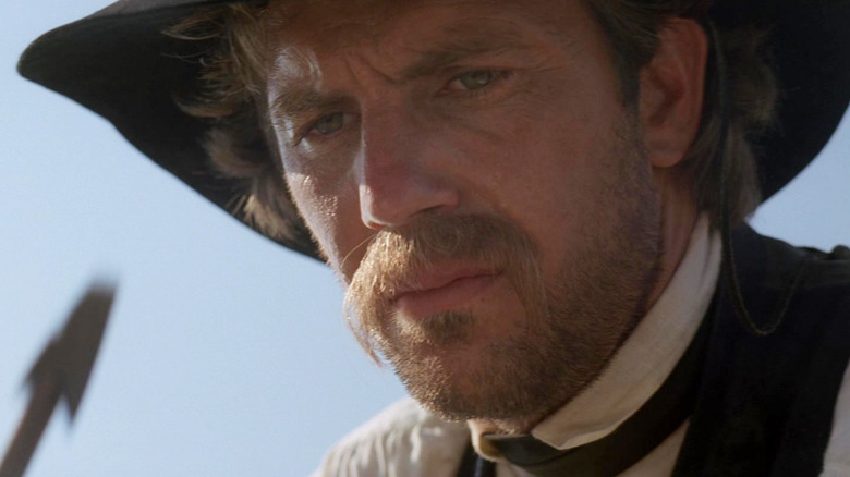 Lieutenant Dunbar looking at an arrow in Dances with Wolves