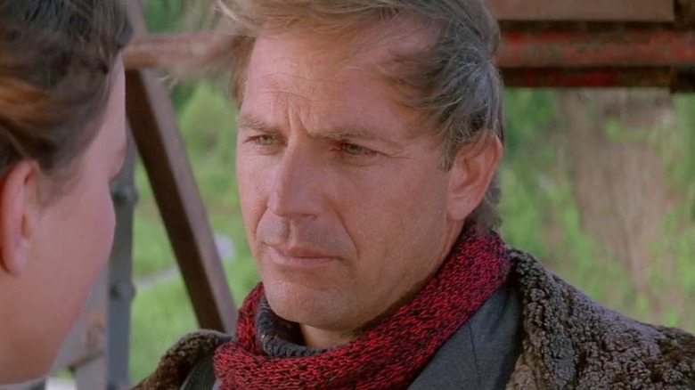 Kevin Costner as the Postman wearing a red scarf in The Postman