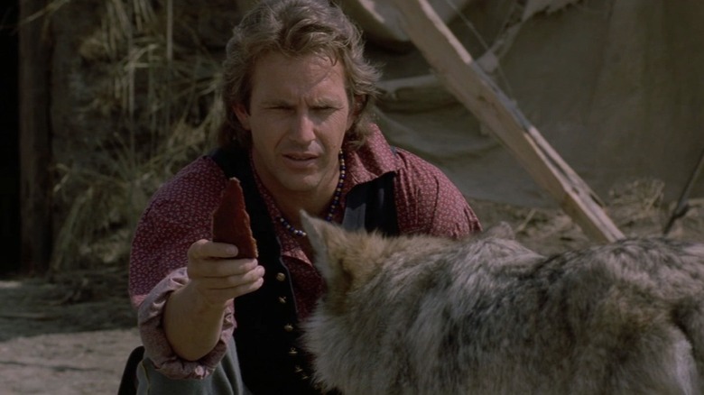 Kevin Costner feeding wolf Dances With Wolves