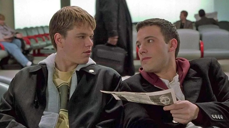 Matt Damon as Loki and Ben Affleck as Bartelby sitting in an airport in Dogma