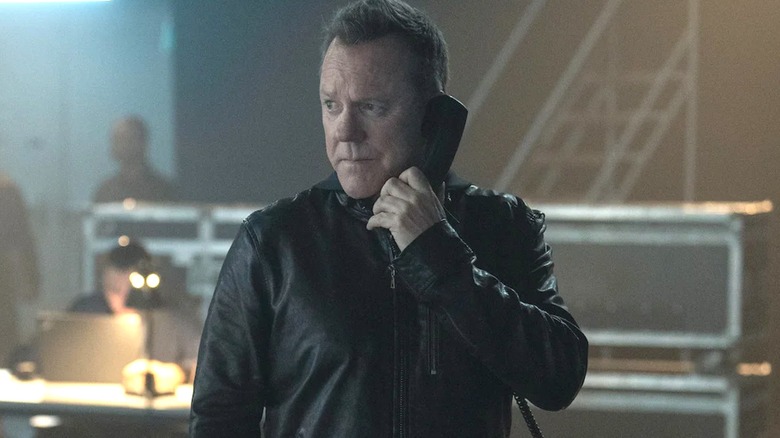 Kiefer Sutherland's John Weir speaks to someone on the phone in Rabbit Hole