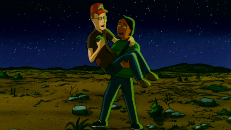 Dale Gribble being carried by his son Joseph in the desert at night on King of the Hill