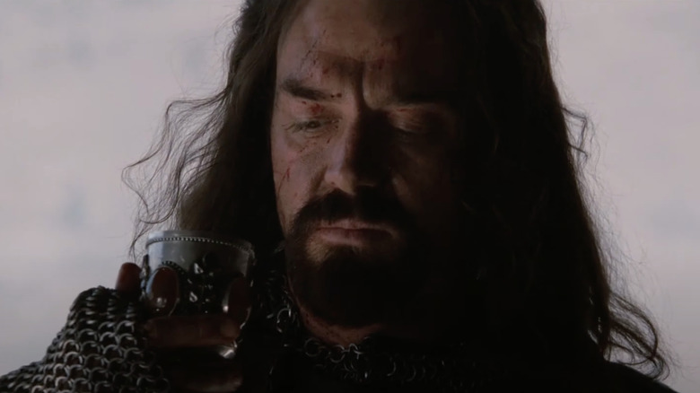 Marton Csokas as Guy of Lusignan looks at a cup in Kingdom of Heaven