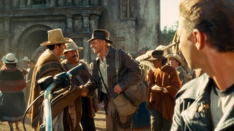 Mindy shaking hands with two Peruvians in Indiana Jones and the Kingdom of the Crystal Skull