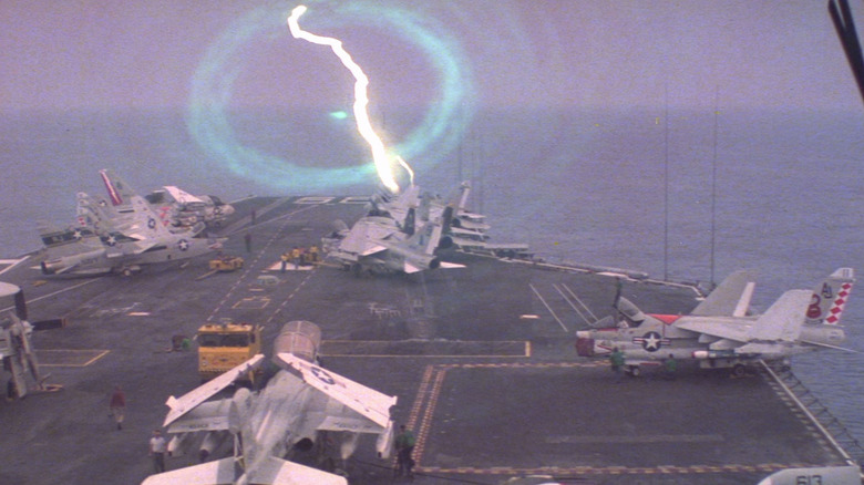 An electric portal opening in front of the USS Nimitz in The Final Countdown