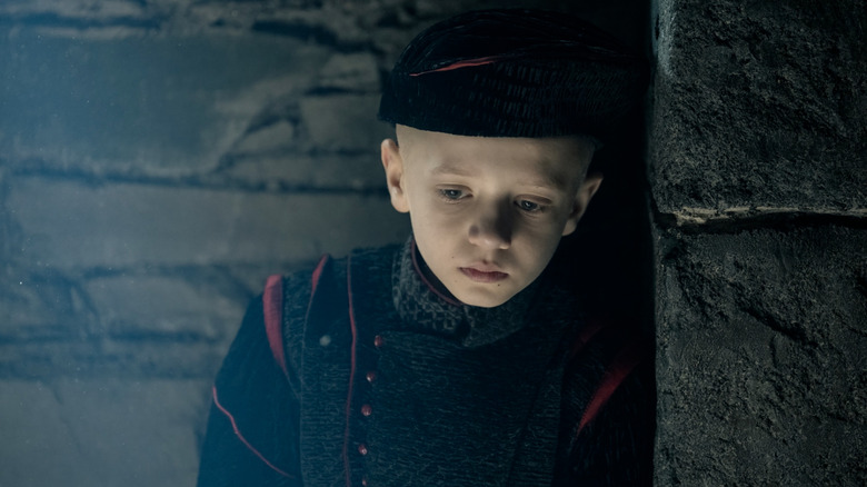 Dexter Sol Ansell as Egg looking downtrodden (while wearing a hat) in A Knight of the Seven Kingdoms