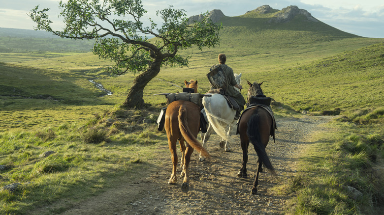 Ser Duncan riding a horse and guiding two more in A Knight of the Seven Kingdoms
