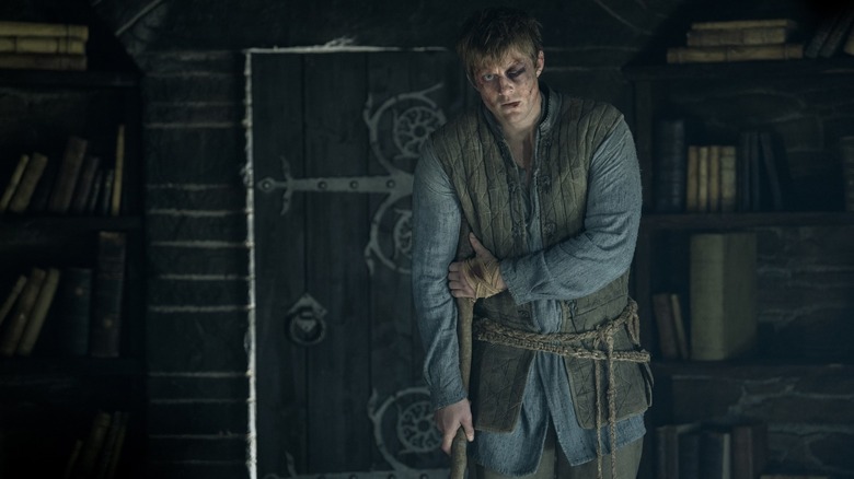 Dunk, looking battered and bruised, leaning on a crutch in A Knight of the Seven Kingdoms