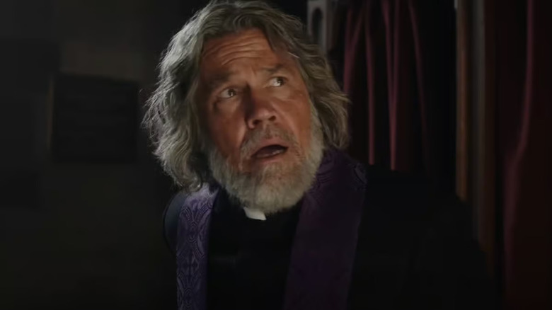 Jefferson Wicks looking shocked outside of the confessional booth in Wake Up Dead Man