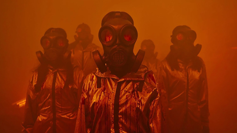 people in suits and gas masks in the witch 2: the other one