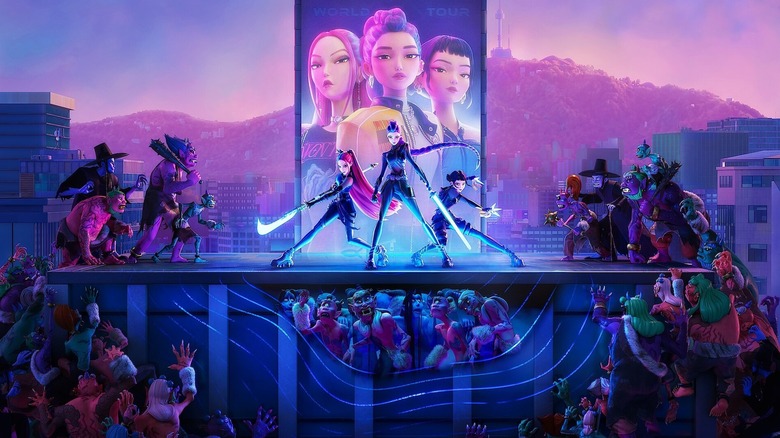 HUNTR/X fighting demons in front of a massive billboard of their upcoming tour in KPop Demon Hunters