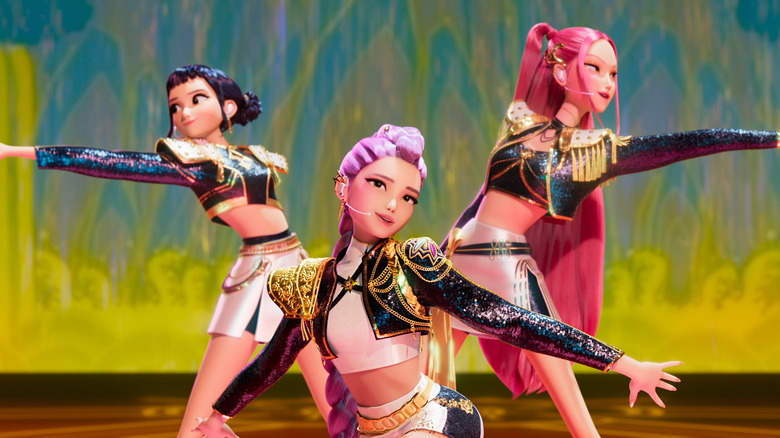 Huntrix performing on stage in KPop Demon Hunters
