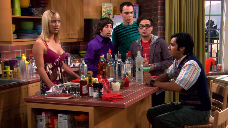 Penny, Howard, Sheldon, and Leonard staring at Raj while he drinks on The Big Bang Theory