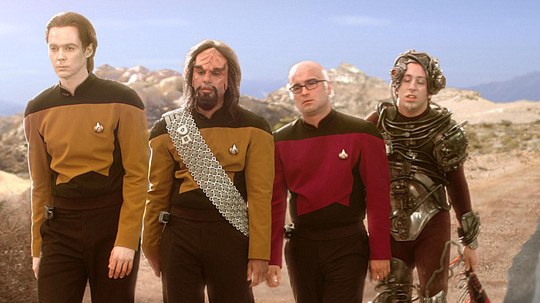 Sheldon, Raj, Leonard, and Howard in Star Trek outfits in the desert on The Big Bang Theory