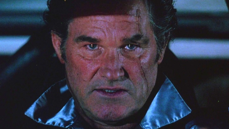 Kurt Russell as Stuntman Mike looking straight at the camera while driving in Death Proof