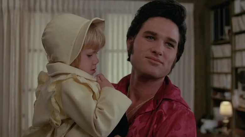 Elvis holding baby Lisa Marie in the 1979 TV series Elvis