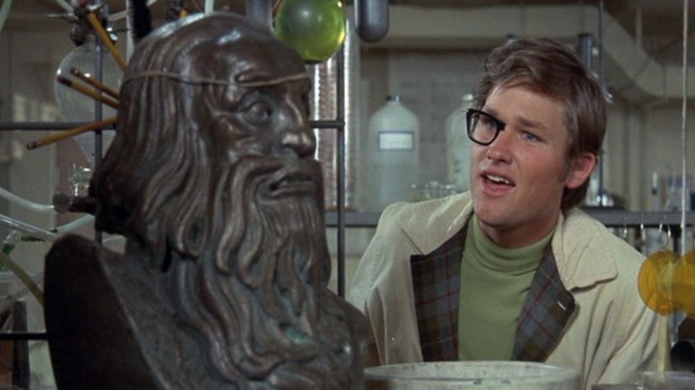 Dexter Riley with half-invisble glasses and a bust of an ancient man in Now You See Him, Now You Don't