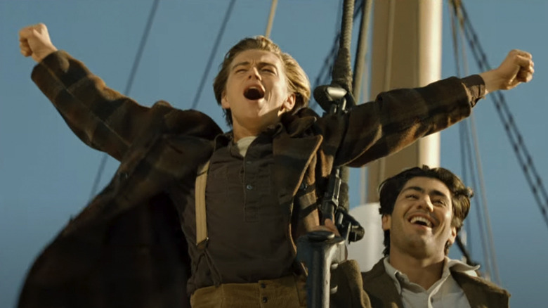 Leonardo DiCaprio declares that he's the king of the world as Jack Dawson (while Danny Nucci as Fabrizio De Rossi looks on) in Titanic