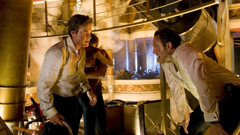 Kurt Russell as Robert Ramsey taalking with Josh Lucas as Dylan Johns as the ship falls apart on Poseidon