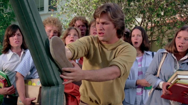 Dexter Riley staring at a telephone pole he accidentally bent with his foot in The Strongest Man in the World