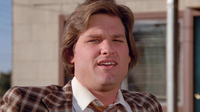 Kurt Russell as Rudy Russo looking dismayed in Used Cars