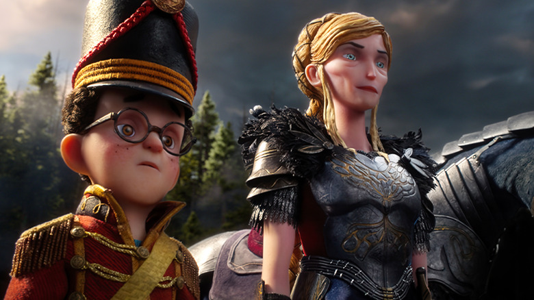 Jacob Tremblay as the voice of Curtis Mehlberg standing next to Carey Mulligan as the voice of Alexandra wearing armor in Wildwood