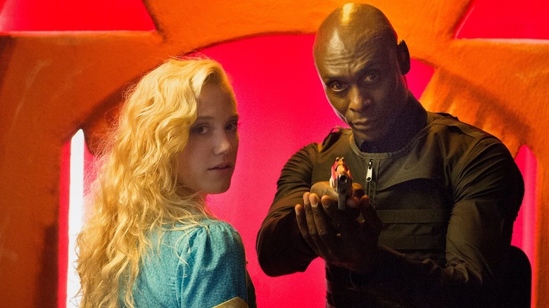 Maika Monroe and Lance Reddick in The Guest