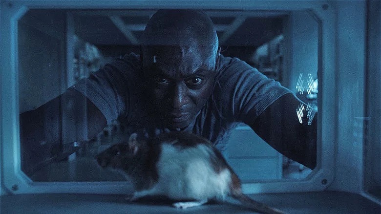 Albert Wesker observing rat in enclosure in Resident Evil