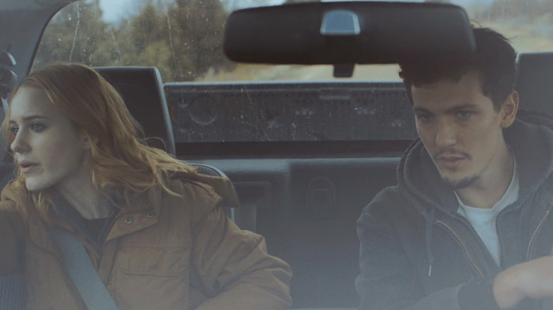 Rachel Brosnahan's Jamie sits alongside Tyler Riggs' John Turner in a car in Boomtown