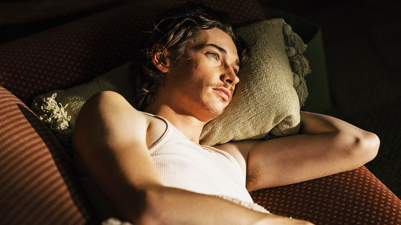 Jacob Lofland's Cooper Norris lays in bed in Landman