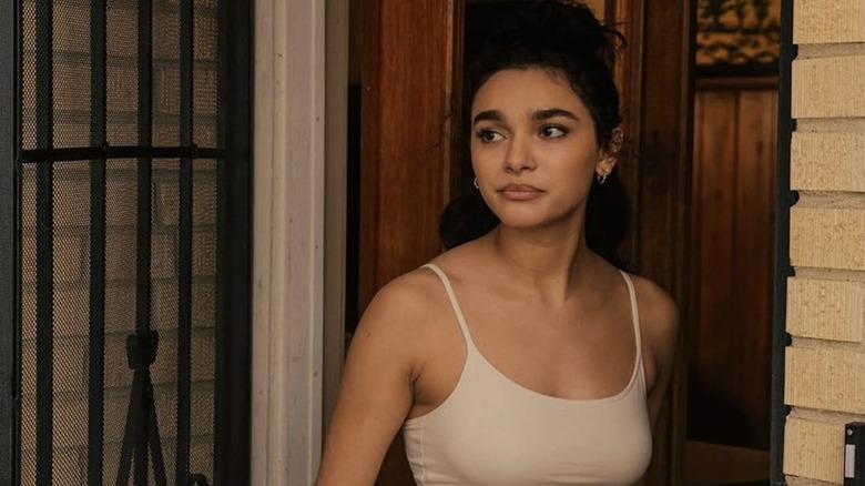 Paulina Chávez as Ariana Medina stands at the door to her house in Landman