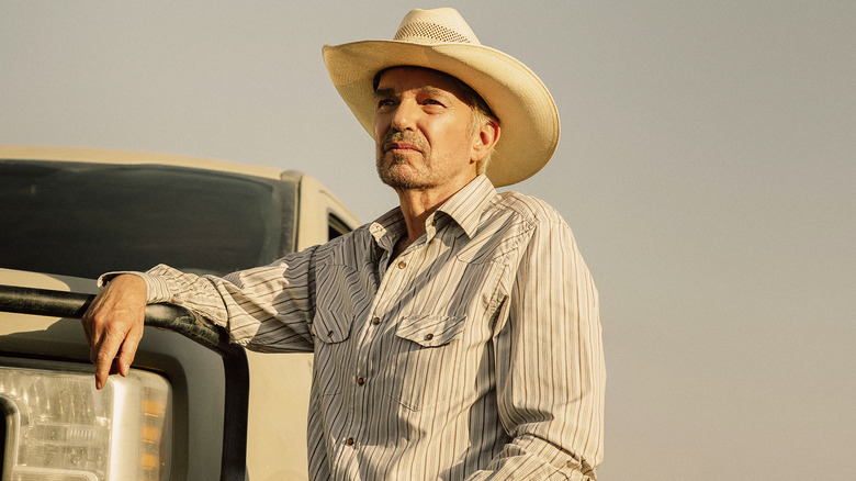 Billy Bob Thornton's Tommy Norris stands beside his truck in Landman