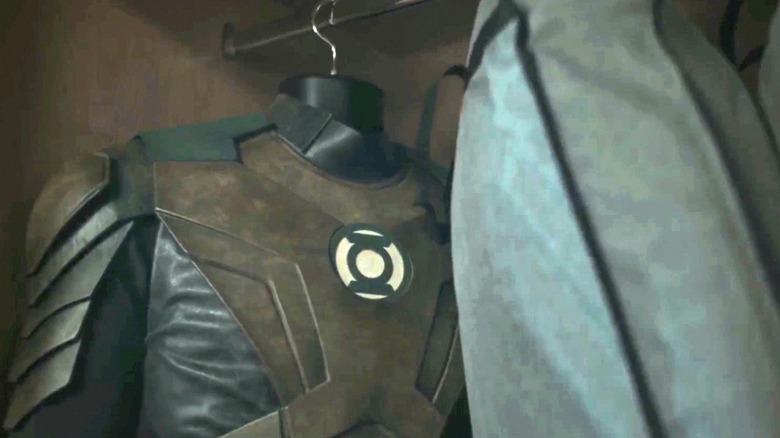 Green Lantern suits hang in a closet in Lanterns
