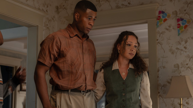 J. Alphonse Nicholson as John Stewart Sr. standing next to Jasmine Cephas Jones as Bernadette Stewart in Lanterns