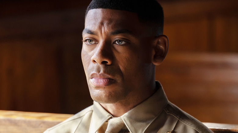 Aaron Pierre's John Stewart is seen in closeup as he sits in military uniform in Lanterns