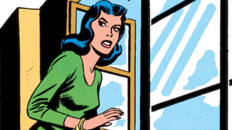 Carol Ferris stands by a window in a panel from Showcase #22