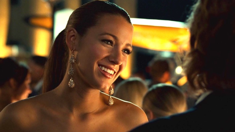 Blake Lively's Carol Ferris smiles as she stands at an outdoor party in Green Lantern