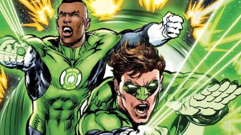 John Stewart and Hal Jordan firing their power rings as Green Lanterns, surrounded by explosions