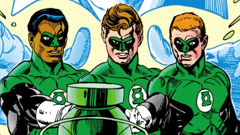 John Stewart, Hal Jordan and Guy Gardner as Green Lanterns stood in front of a Green Lantern power battery