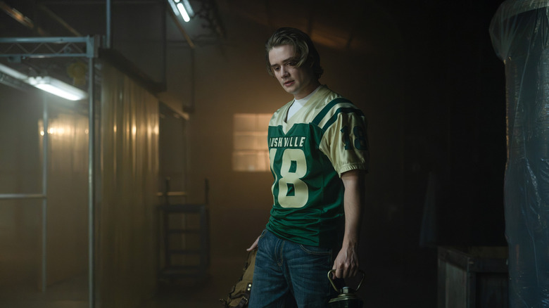 Shea Pritchard's Noah  Macon stands holding a lantern in Lanterns