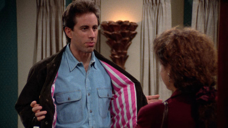 Jerry showing his candy-striped jacket lining to Elaine on Seinfeld